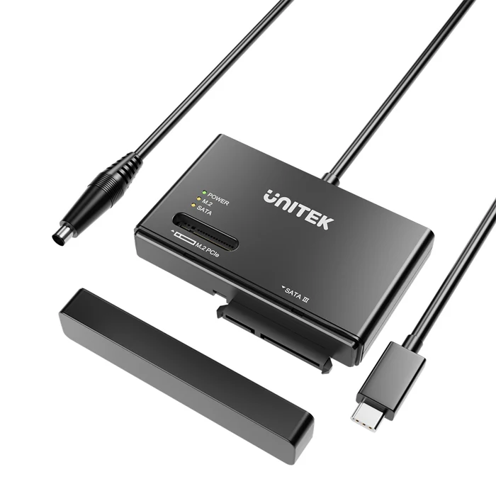 Box ổ cứng Unitek S1232A01-EU Unitek S1232A01-EU nhìn từ trên: khe M.2 PCIe, đầu nối SATA III, ba đèn POWER, M.2, SATA, cáp USB-C, cáp nguồn đầu tròn và nắp chắn bụi rời